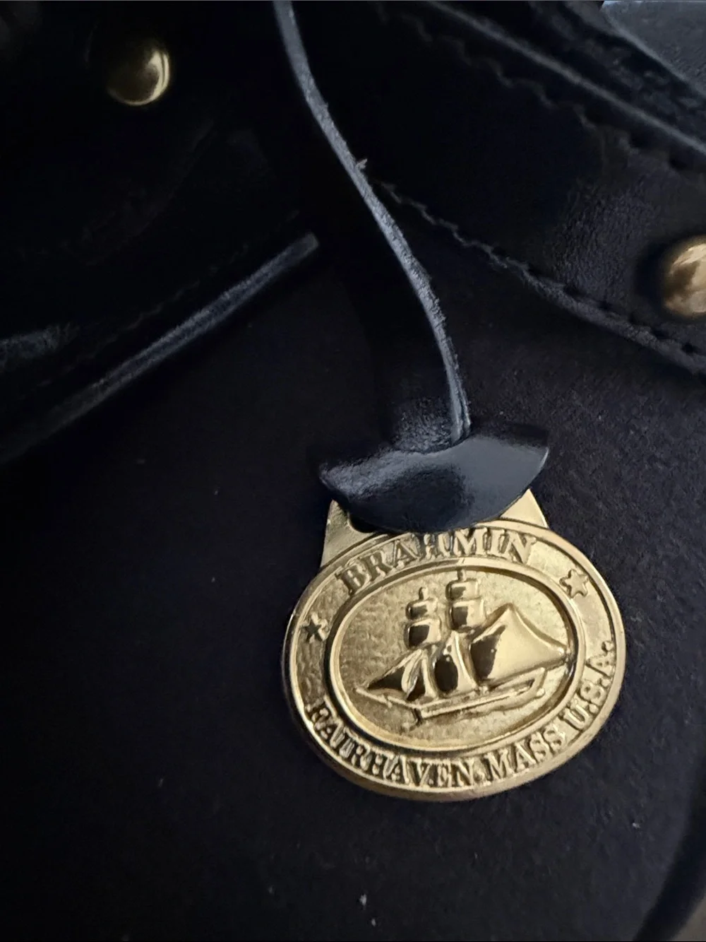 Brahmin Black Leather Messenger Bag with Gold Medallion